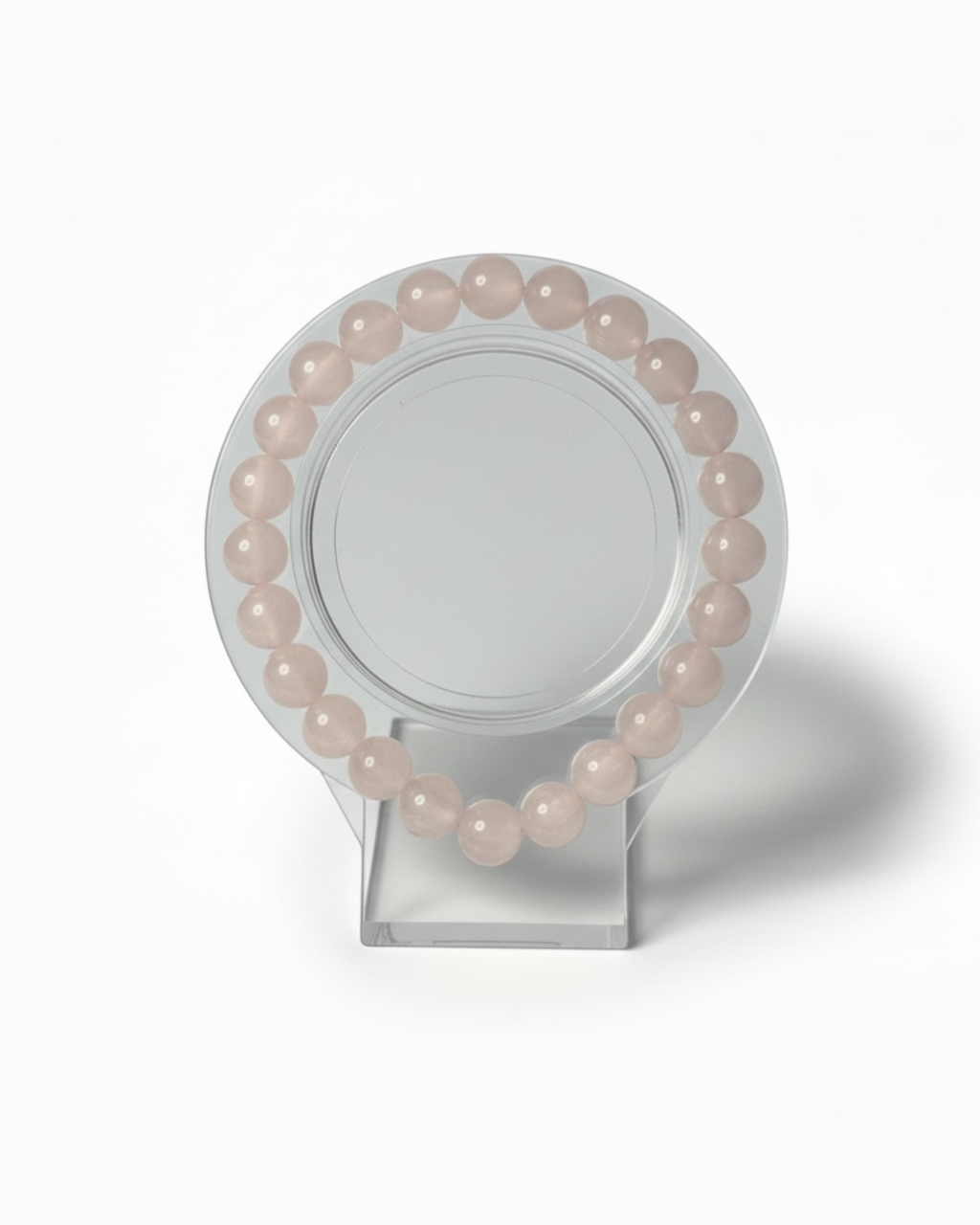 Amelia Jane Handmade Creations 7-inch beaded bracelet made of smooth, pale pink rose quartz gemstones.
