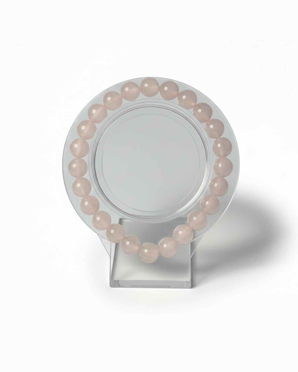 Amelia Jane Handmade Creations 7-inch beaded bracelet made of smooth, pale pink rose quartz gemstones.