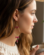 Amelia Jane Handmade Creations ruby chandelier earrings with S925 posts worn by a woman in profile
