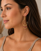 Amelia Jane Handmade Creations Ruby Moon earrings featuring gold crescent moons and dangling red ruby gemstones