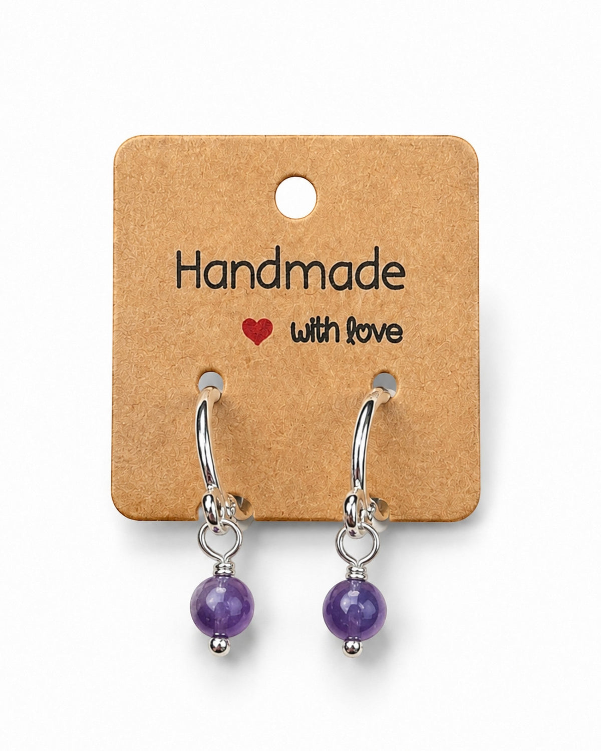 Amelia Jane Handmade Creations 15mm silver-filled huggie hoop earrings featuring dangling purple amethyst gemstones.