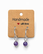 Amelia Jane Handmade Creations 16mm S925 sterling silver huggie hoop earrings with dangling purple gemstone beads.