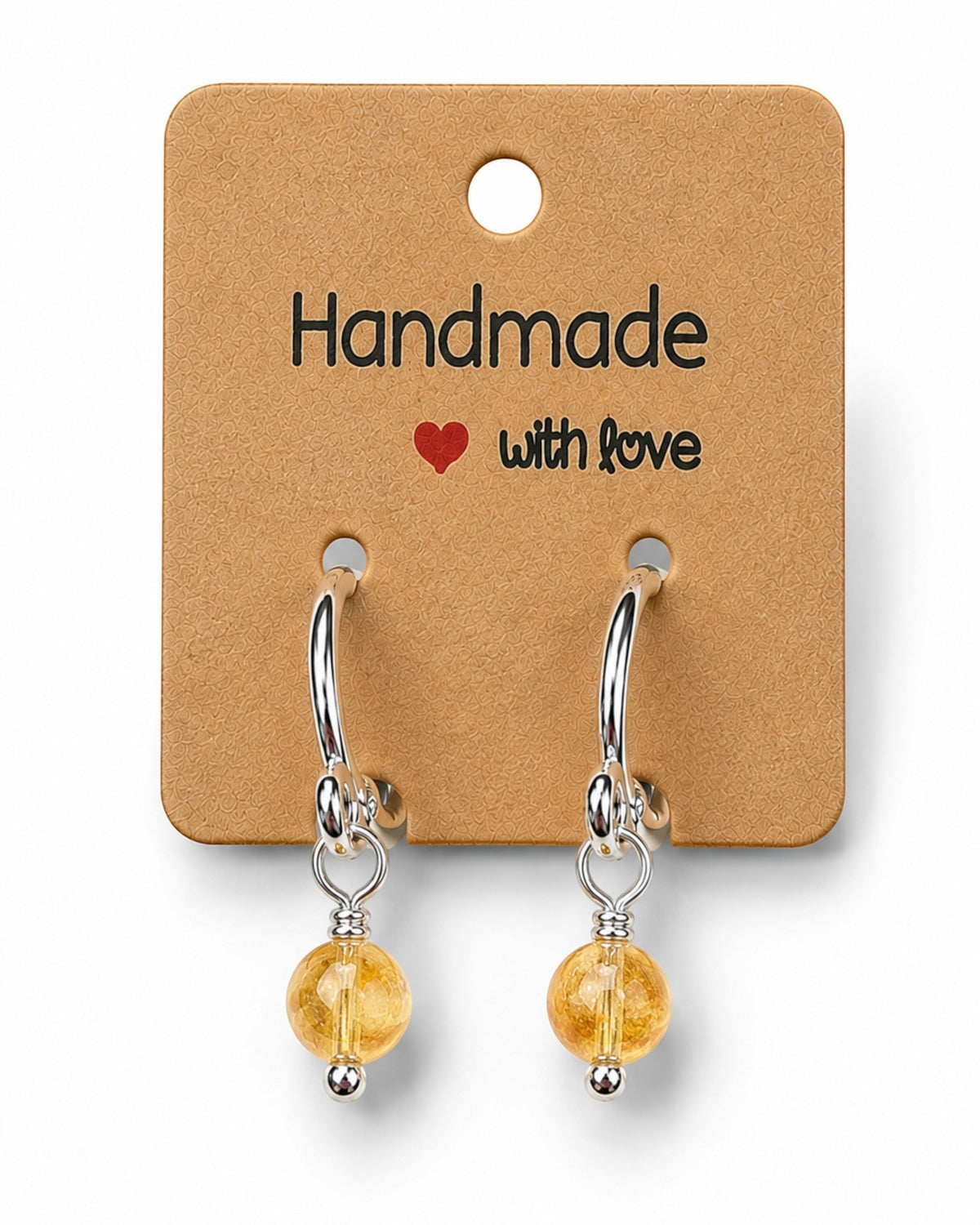 Amelia Jane Handmade Creations 15mm silver-filled huggie hoop earrings featuring handcrafted yellow gemstone beads.