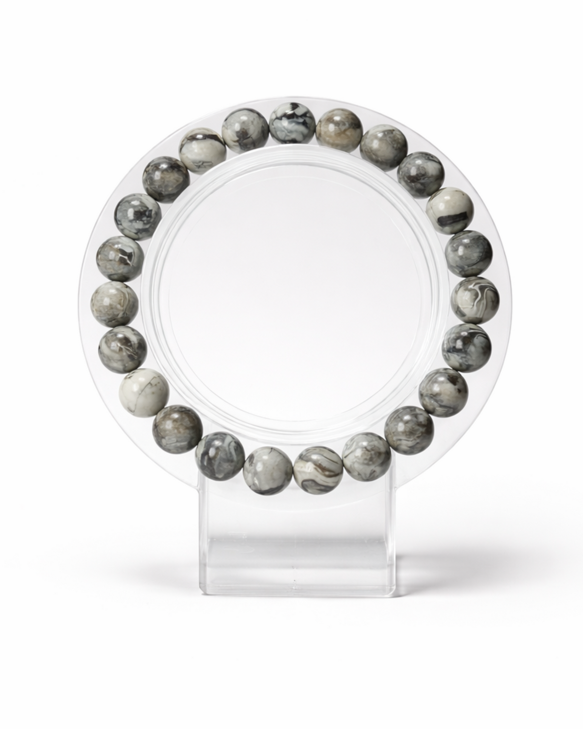 Amelia Jane Handmade Creations 7-inch beaded bracelet featuring natural silver Picasso jasper stones on a display stand.