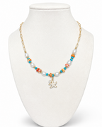 Amelia Jane Handmade Creations Salt and Sun necklace with gold filled chain, starfish pendant, and colorful beads.