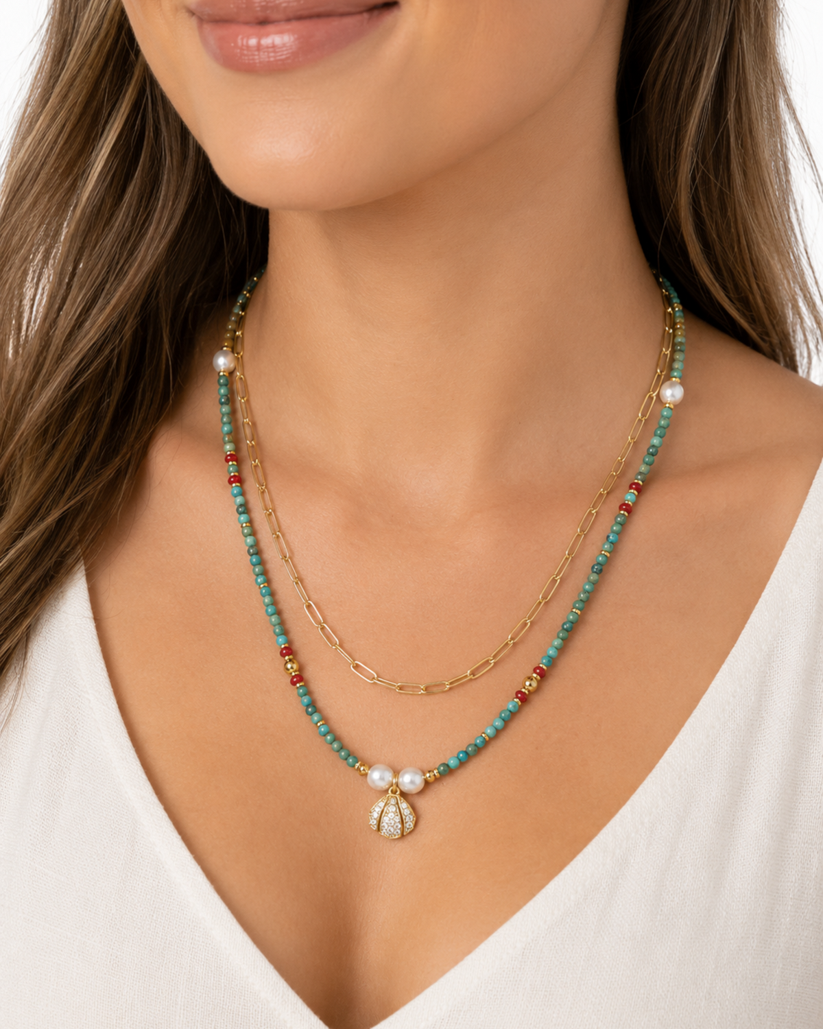 Amelia Jane Handmade Creations Tidal Shores layered necklace with turquoise, red coral, pearls, and gold shell pendant