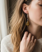 Amelia Jane Handmade Creations tiger eye teardrop earrings with S925 silver posts worn by a woman