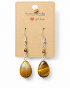 Amelia Jane Handmade Creations tiger eye teardrop earrings with S925 silver posts on a display card.