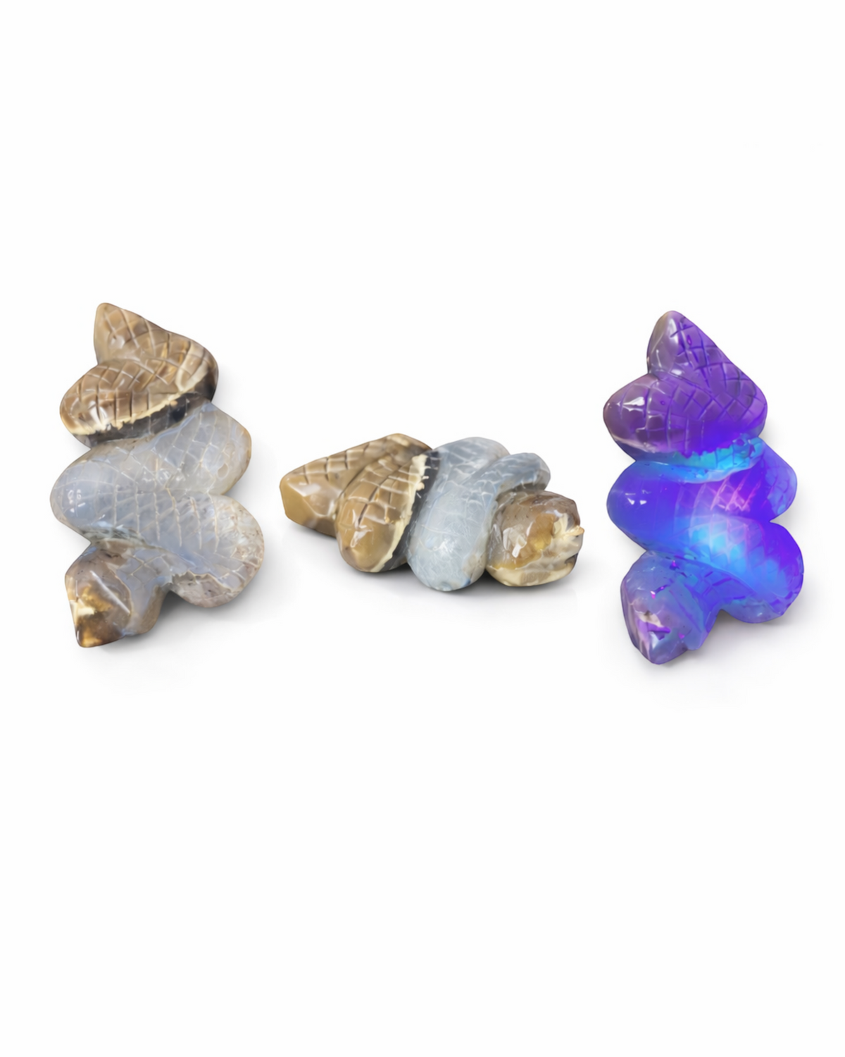 Amelia Jane Handmade Creations volcano agate double snake carving in gray-blue and taupe, shown with UV reactive glow.