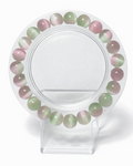Amelia Jane Handmade Creations 7-inch watermelon selenite beaded bracelet with pink and green cat eye effect stones.