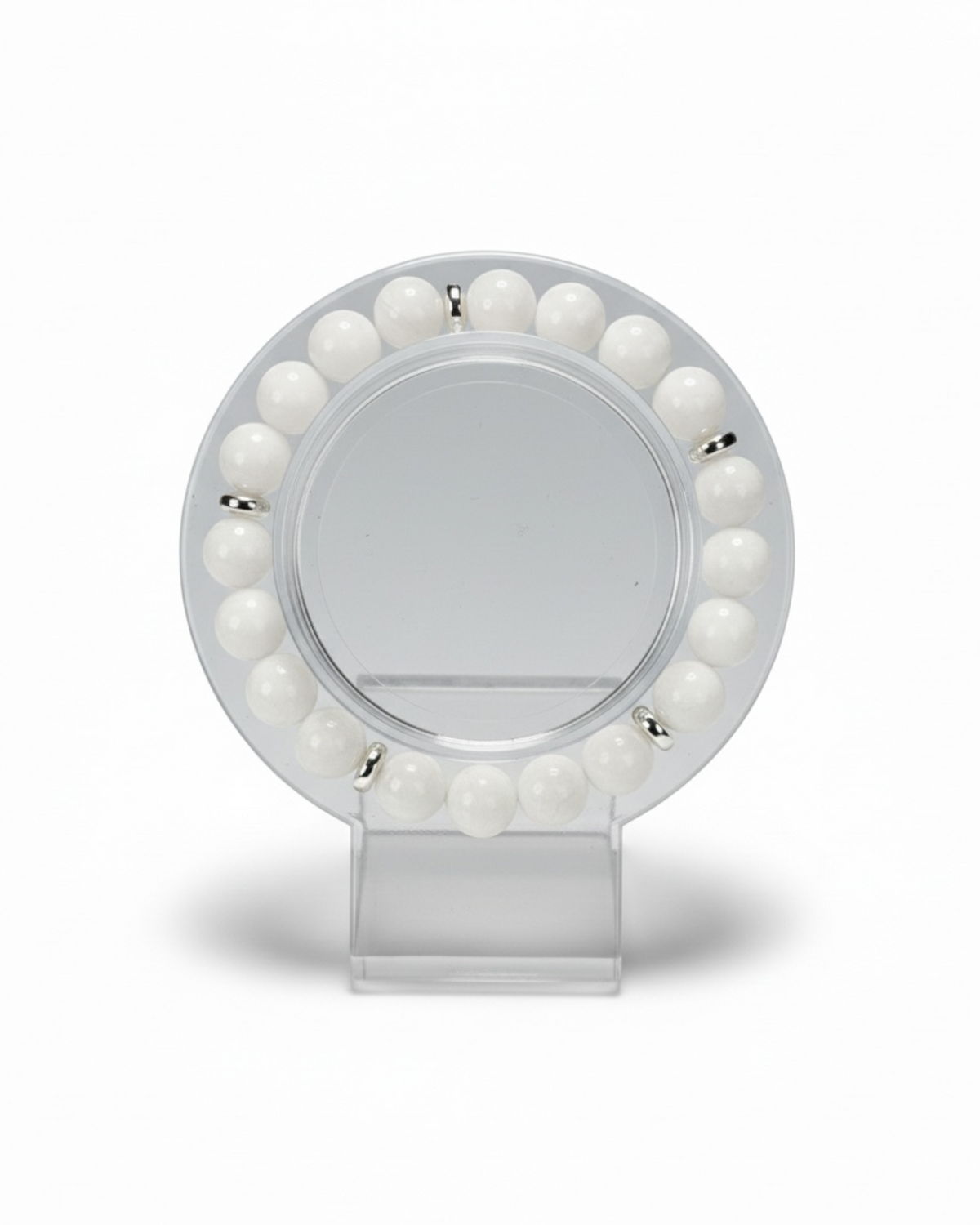 Amelia Jane Handmade Creations 7-inch white jade and silver hematite beaded bracelet on a clear display stand.