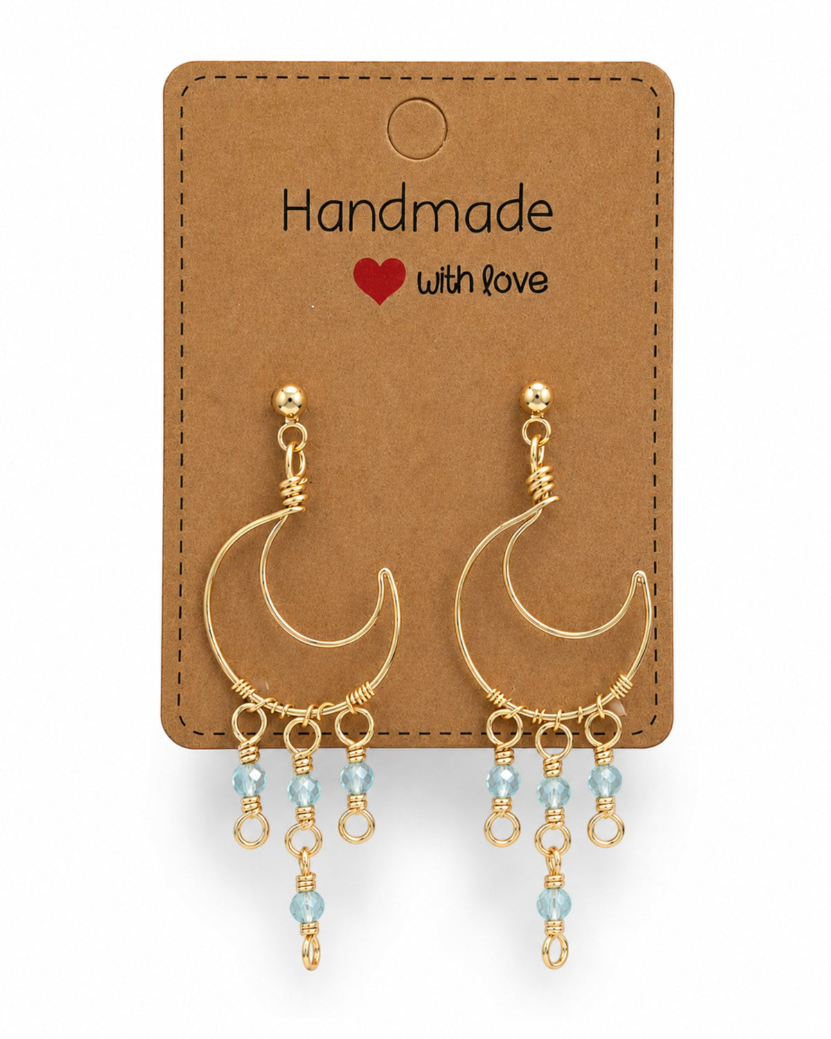Amelia Jane Handmade Creations gold wire wrapped moon earrings with blue crystal dangles and s925 posts on display card