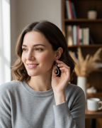 Amelia Jane Handmade Creations multi-colored zircon teardrop earrings with S925 posts worn by a smiling woman